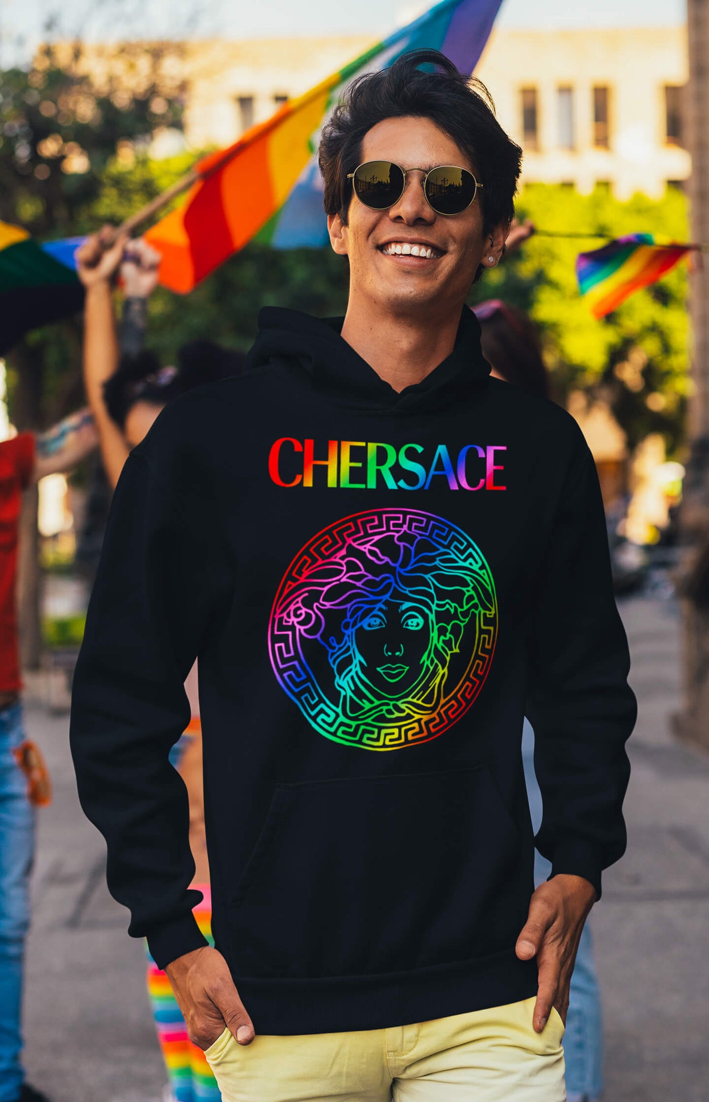 Stylish man with a CHERSACE by Gllamazon hoodie at the Pride parade.