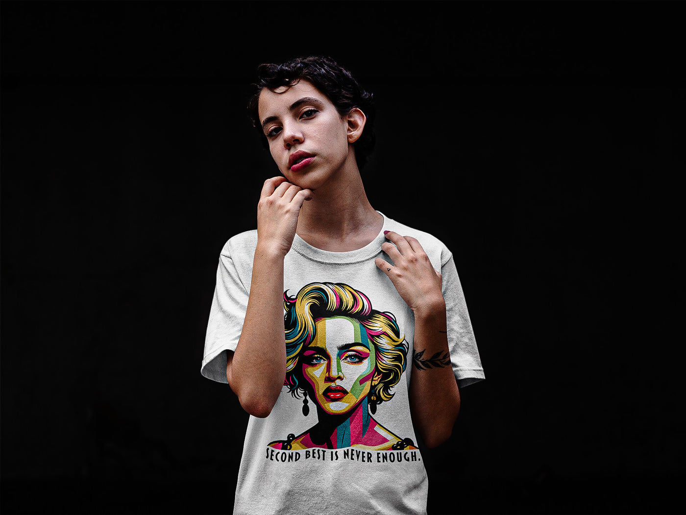 A girl with a pixie haircut wearing a 'Second Best Is Never Enough' Madonna t-shirt by Gllamazon. Color: White.