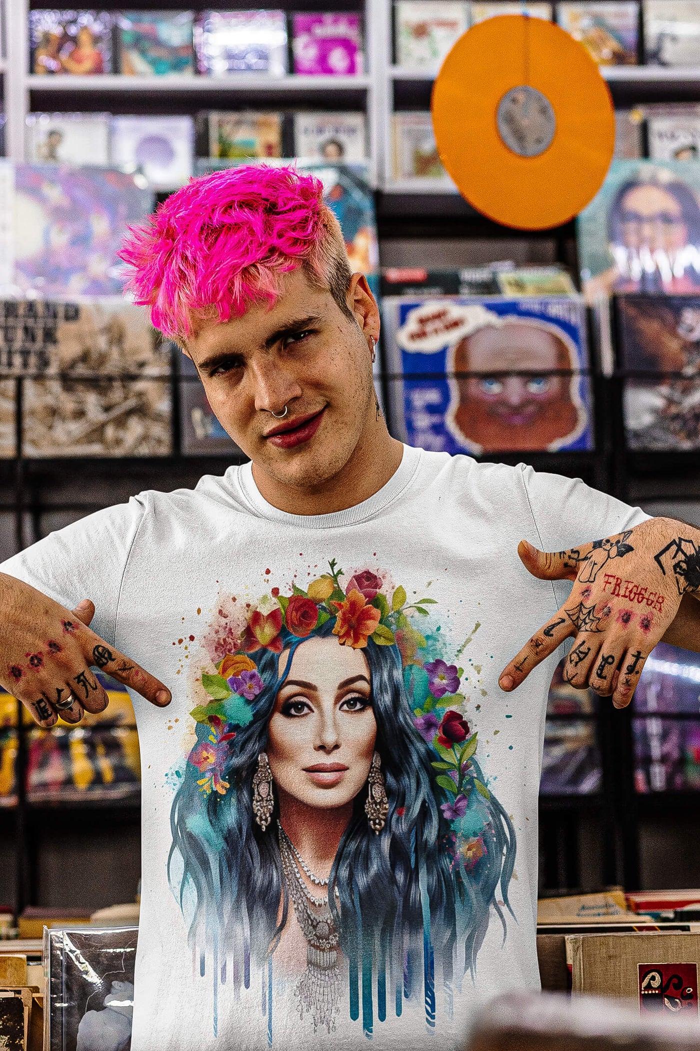 Tattooed young white man with pink hair wearing Gllamazon's Cher-ry Blossom Cher T-shirt. Color: White.