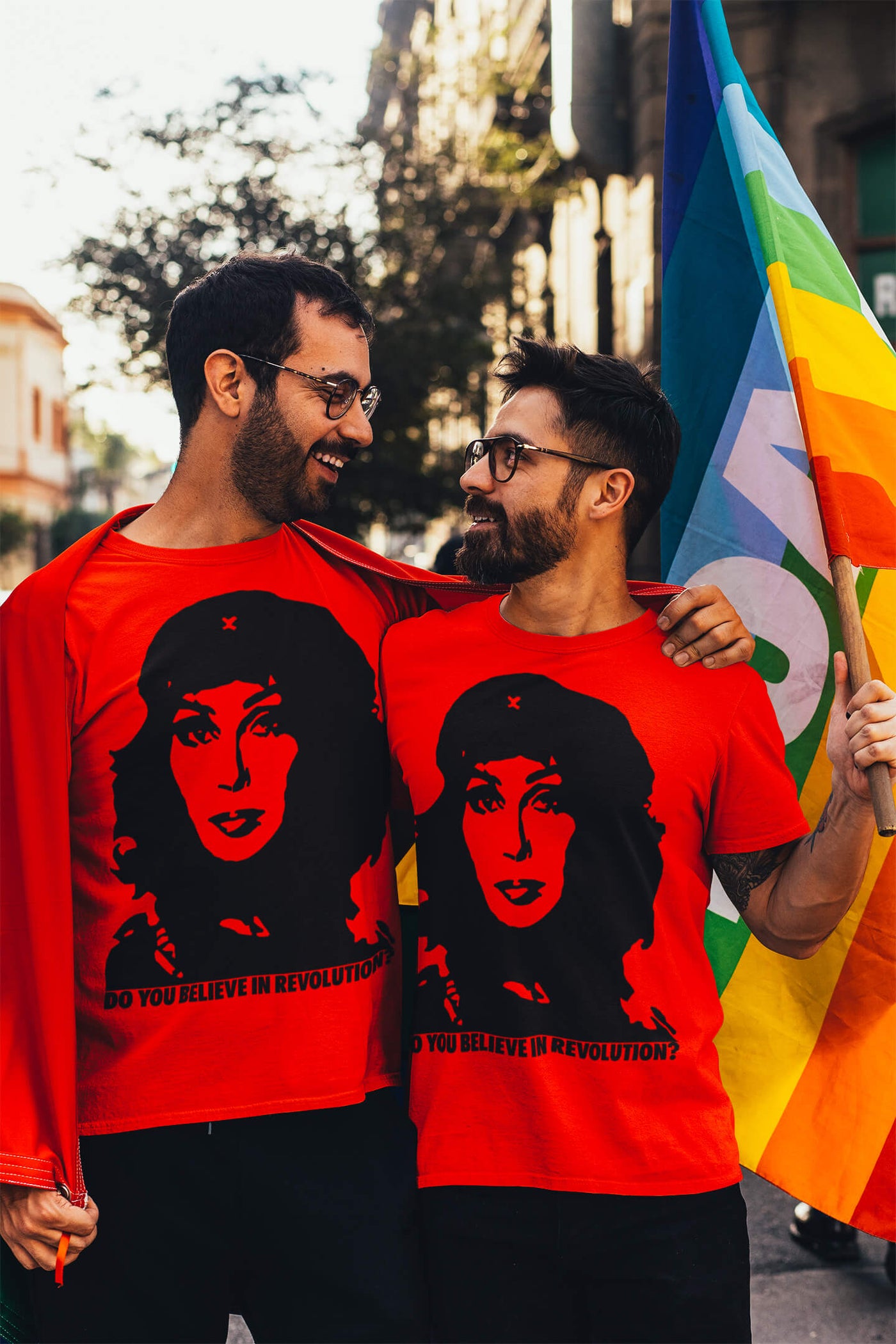 Gay couple wearing Gllamazon's Cher Guevara T-shirt.